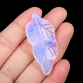 Carved opal stone leaf pendant with milky white iridescence and detailed vein patterns - Opal (Synthetic)