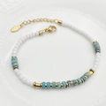 Detail of beaded bracelet with blue marble stones and gold stainless steel spacers - Blue
