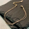 Bracciale a doppio strato in oro rosa con catena a serpente su sfondo di pietra nera - Oro rosa