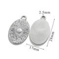 Detailed macro view of silver tarot sun pendant showing front relief and back texture - Oval Sun-Steel Color