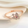 Macro view of rose gold butterfly bracelet with white and pink crystal rhinestones - Rose Gold