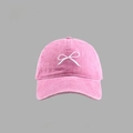 Pink cotton baseball cap featuring white bow embroidery with adjustable strap back - Washed Cotton Bow Baseball Cap Style / Pink