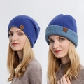 Reversible navy blue knit beanie with leather label and versatile cuff styling - Blue