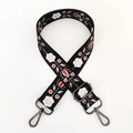 Detail of floral embroidery on woven bag strap with gunmetal swivel snap hooks - Black Ethnic Embroidery / Gunmetal Buckle