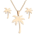 Bohemian gold coconut tree jewelry set featuring a palm leaf necklace and stud earrings - Gold