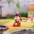 Retro resin girl figurine in red and green Tang dynasty dress holding a bouquet - Walking Among Flowers Small