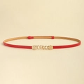 Detail view of red slim PU leather belt with decorative golden metal chain buckle - Red