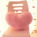 Plush heart-shaped throw pillow in pink soft fabric on chair for cozy home decor - Pink Heart