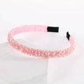 Detail view of pink beaded headband featuring sparkling crystals on soft satin fabric - Pink