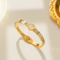 Gold-plated geometric bangle with Roman numeral dial, white shell and shiny rhinestones - Gold