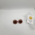 Detailed view of lavender purple flower-shaped sunglasses for kids on a white background - Coffee