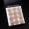 Set of 12 gold flower brooches with sparkling crystals on black display card - KC Gold Tone White Rhinestone Hollow Flower Style (KZ033-1)