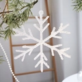 Elegant white sequined snowflake ornament hanging on a green Christmas tree branch - Large Snowflake / Shimmer White