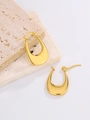 Detailed view of oval golden stainless steel earrings on natural beige stone props - 1-U-Shaped Smooth Style