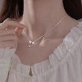 Silver bow necklace for women featuring sparkling zircon inlay shown on model neck - Bowknot Rhinestone Style (XL2799)