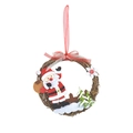 Christmas wreath featuring a Santa Claus figure and red ribbon on natural rattan ring - Santa Claus