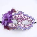 Detail of purple lace mask with silver sequins, faux flower, and soft natural feathers - Purple
