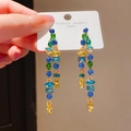 Macro shot of long drop earrings featuring colorful crystal teardrops and S925 silver needles - Style 22# Silver Pin-Blue-Green-Yellow