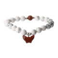 Macro detail of white marble beads and brown sunstone butterfly charm on beaded bracelet - White Turquoise + Gold Sand Stone