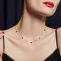 Vintage necklace with gold beads and red stones worn by a model for an elegant look - Garnet Red and Gold Beads Necklace - Gold