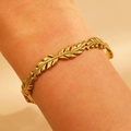 Golden olive leaf cuff bracelet in stainless steel shown on wrist for fashion style - Olive Leaf Beaded (4195)