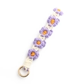 Handmade woven daisy flower keychain with purple and orange petals and golden metal ring - Purple Rice