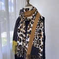 Winter faux cashmere scarf featuring leopard print color blocks and fringe trim - Camel