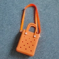 Bright orange EVA perforated tote bag with matching nylon strap and white buckle detail - Orange