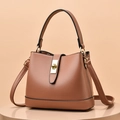 Minimalist tan synthetic leather bucket bag with top handle and gold turn-lock hardware - Pink