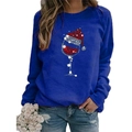 Women's blue long sleeve Christmas wine glass print sweatshirt with a crew neck - S / Tops / Blue