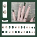 Unghie finte corte riutilizzabili con design verde scuro e motivi a stella astratti - Il Mago di Oz Verde (R440)