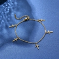 Golden stainless steel chain bracelet with five cross charms on navy blue fabric - Cross Pendant Single Layer