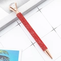 Red rhinestone ballpoint pen with rose gold accents and a large crystal diamond top - 1.0mm Bullet Tip / Red