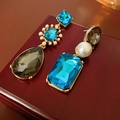 Detailed shot of vintage gold earrings with blue gems and pearls on a dark wood box - Earrings (925 Silver Pin-Gold-Blue)