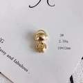 Detail of golden astronaut pendant with heart motif measuring 19 by 12mm on card - 3# Astronaut