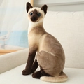 Realistisches Siamkatze Plüschtier in Sitzposition mit blauen Augen und weichem Fell - 20cm / Sitzende Siamkatze
