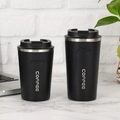 Dual sizes of black stainless steel coffee mugs with flip lids on marble desk - Normal Lid Black