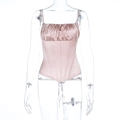 Dettaglio del top a corsetto in raso rosa con design a pieghe e stecche interne - XS / Rosa
