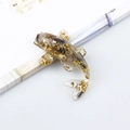 Resin koi fish figurine with embedded gold leaf and a translucent amber finish - Ghost