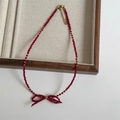 Detailed shot of handmade red faceted crystal bow necklace with golden beads - 4# Red
