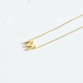 Minimalist gold letter M pendant necklace for women on a clean white background - M