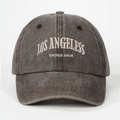 Detail of embroidered LOS ANGELES lettering on vintage washed grey baseball cap fabric - Coffee