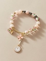 Pink and gold vintage beaded bracelet with floral charms and clock pendant - Glass Bead Charm Bracelet