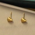 Minimalist gold heart-shaped titanium steel stud earrings on a beige textured surface - Solid Heart Studs(AG226) / Gold