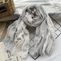 Gray and white striped cotton linen scarf with tassel fringe on a display rack - Light Grey Stripe