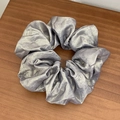 Shiny silver metallic scrunchie for women with elegant pleated texture on wooden desk - Large / Light Gray