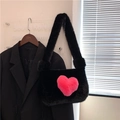 Faux fur black shoulder bag featuring a pink plush heart pattern for winter fashion - Black