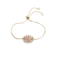 Macro shot of gold MOM slider bracelet featuring colorful cubic zirconia micro-inlay detail - Box Chain MOM