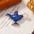 Broche de lámpara de Aladino exótico con esmalte azul y acabado dorado sobre fondo vintage - Lámpara Mágica / Azul
