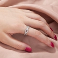 Fashionable silver chain ring with zircon stones on pink silk worn by a model - Bamboo Joint Style (SE899)